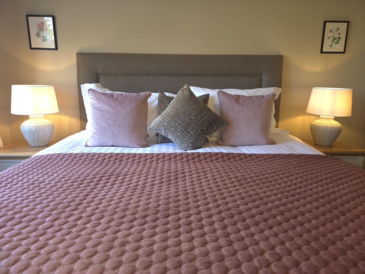 Master bedroom with pink throw