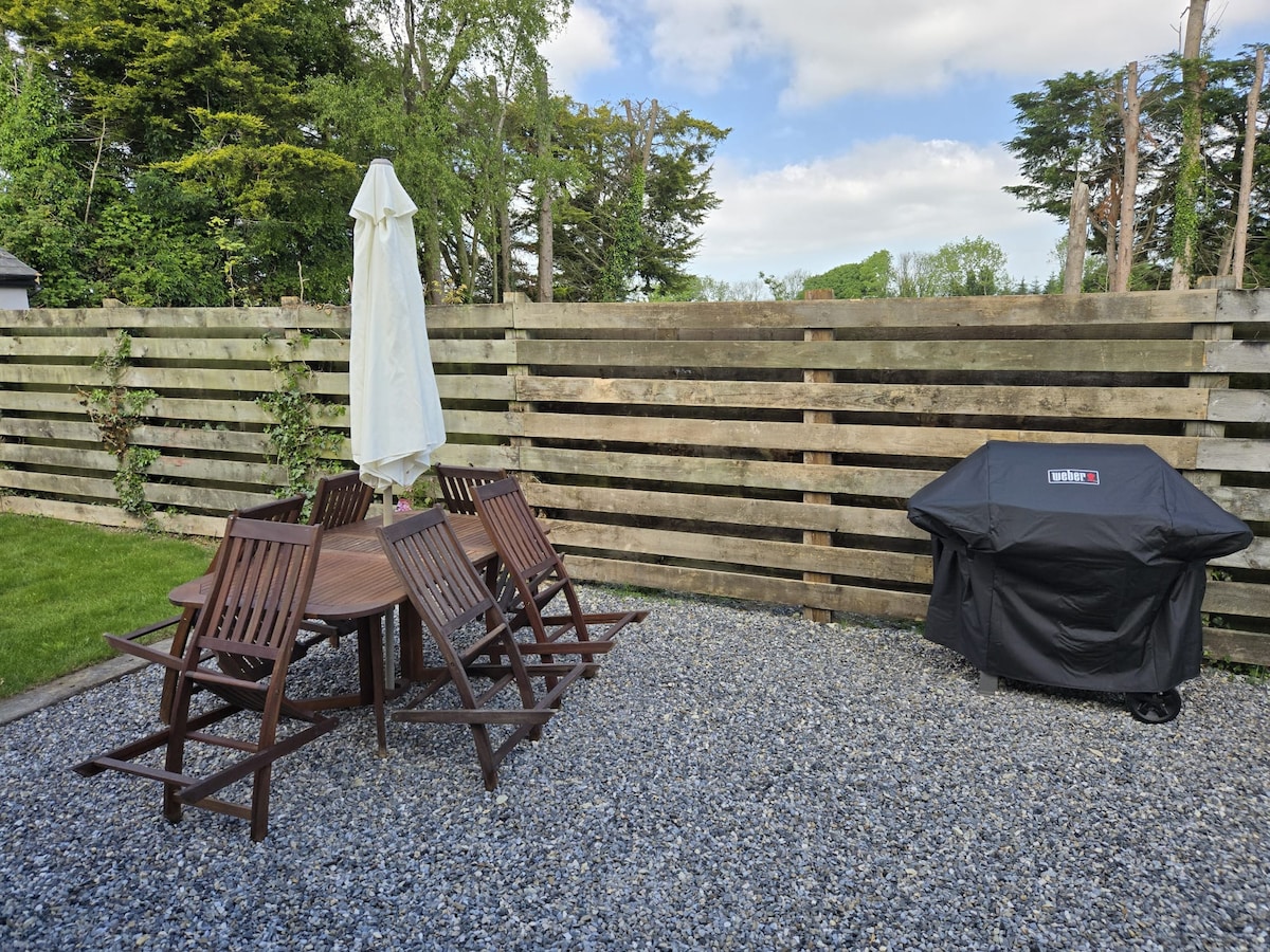 Patio with dining set and BBQ