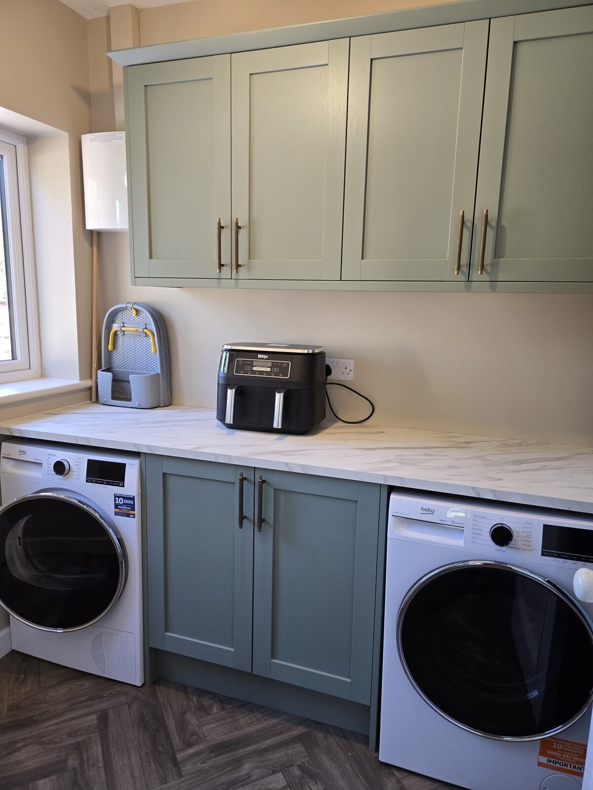 Utility room with washer and dryer